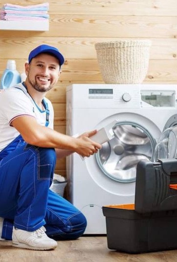 A dryer repair specialist fixing a machine that is not drying properly.