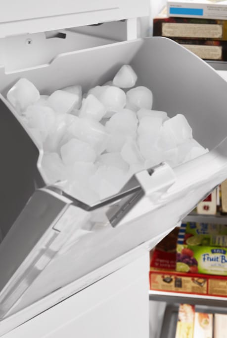 An ice maker repair expert restoring the ice-making function of the appliance.